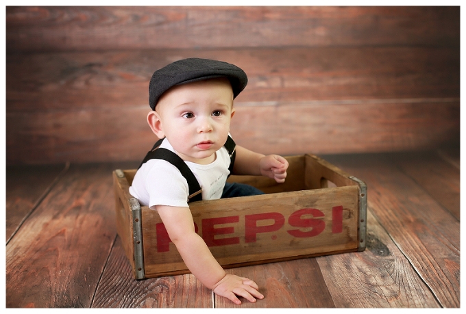 9 month portraits baby boy in suspenders maryland family photographer