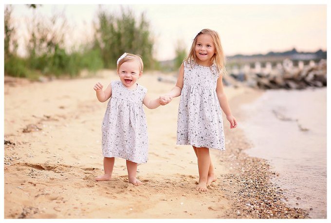 Annapolis Family photographer girls matching dresses on sand 