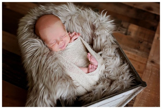Newborn Portraits baby smiles 